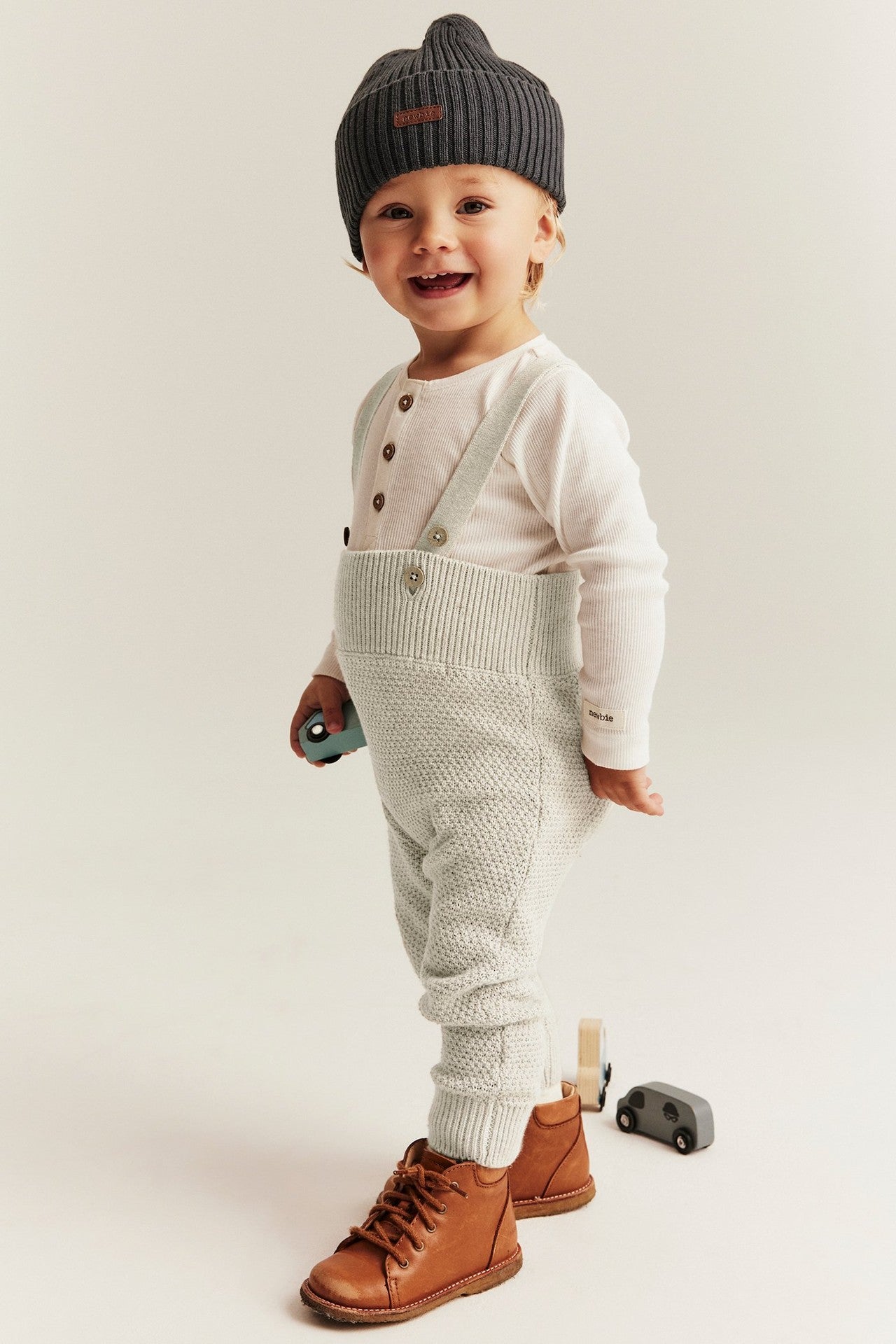 Baby beige knitted dungarees