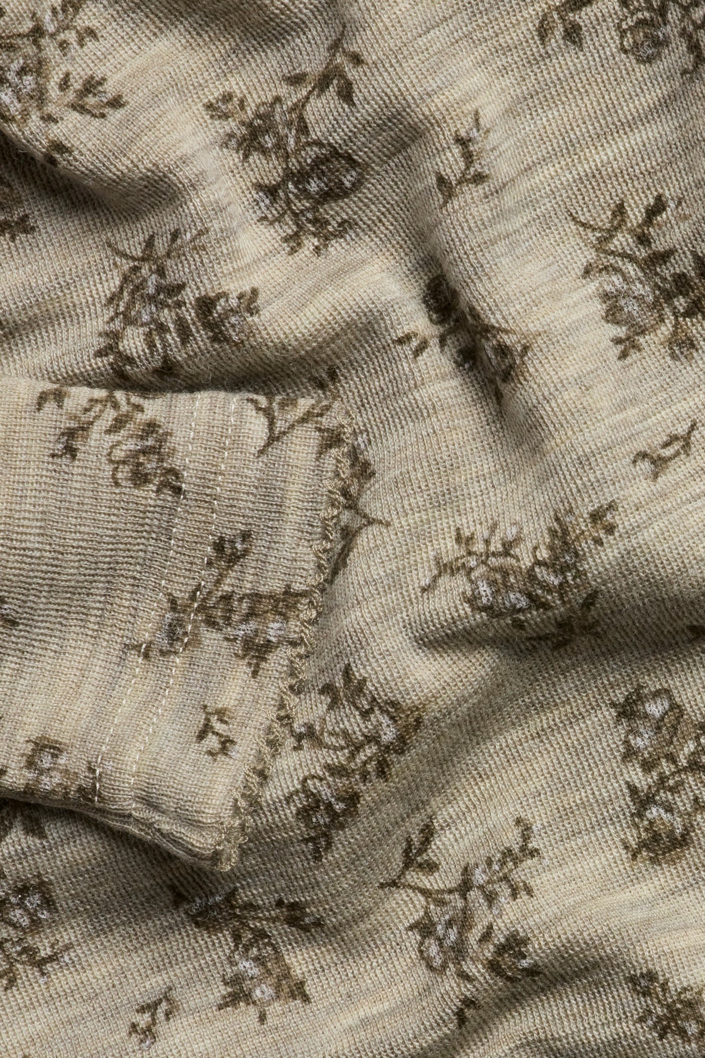 Baby beige floral merino wool bodysuit