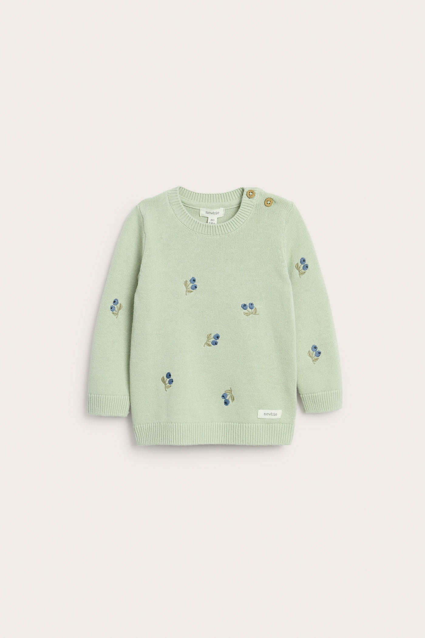 Baby green knitted jumper with blueberries