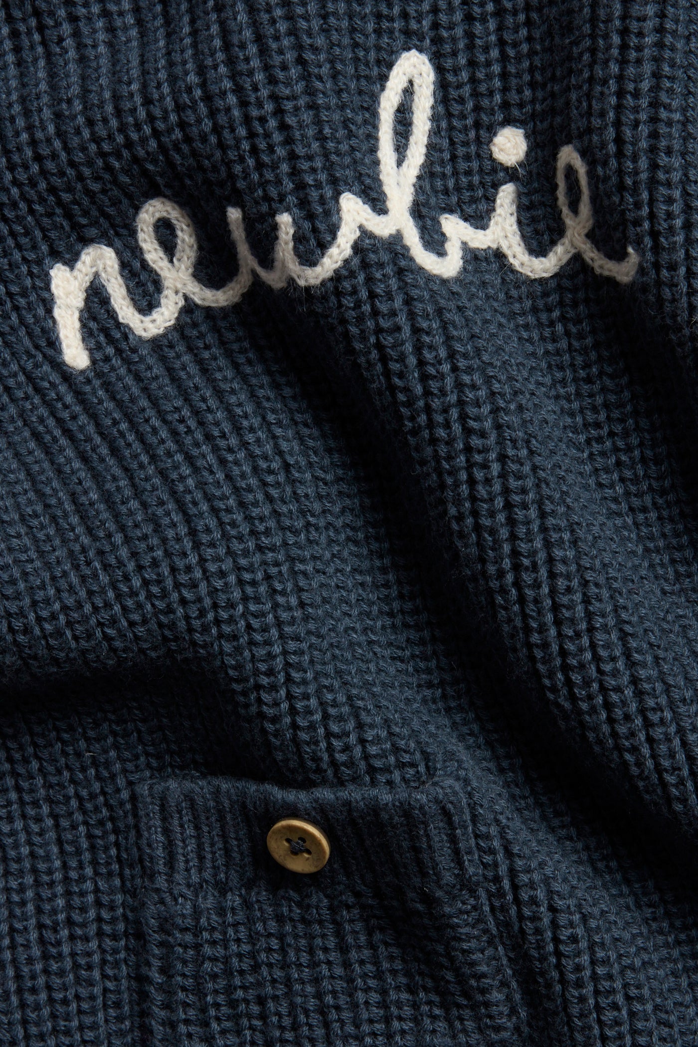 Baby blue knitted jumper with Newbie logo