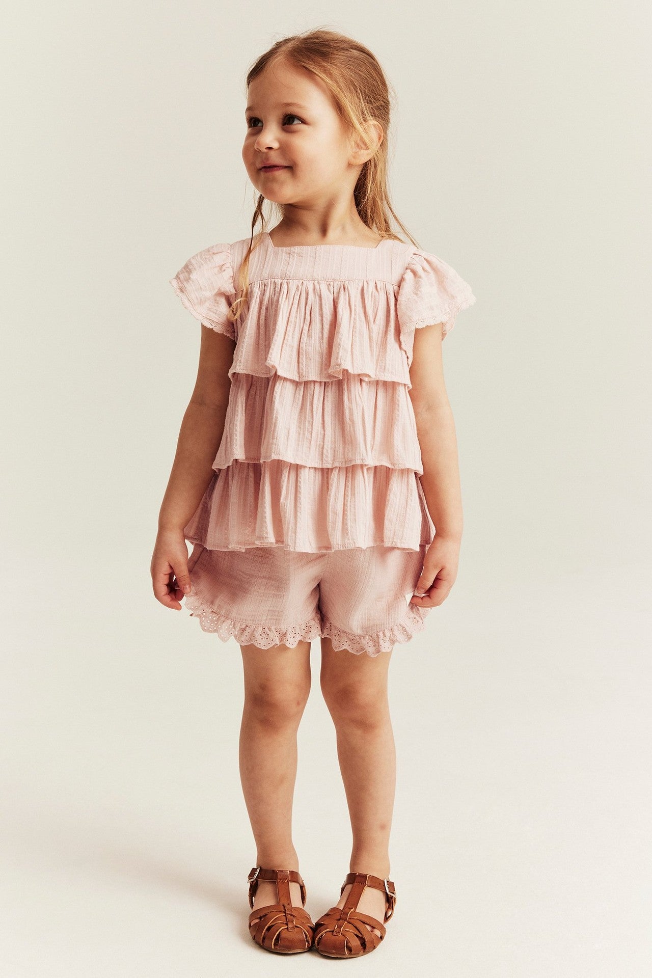 Kids pink woven shorts with frill