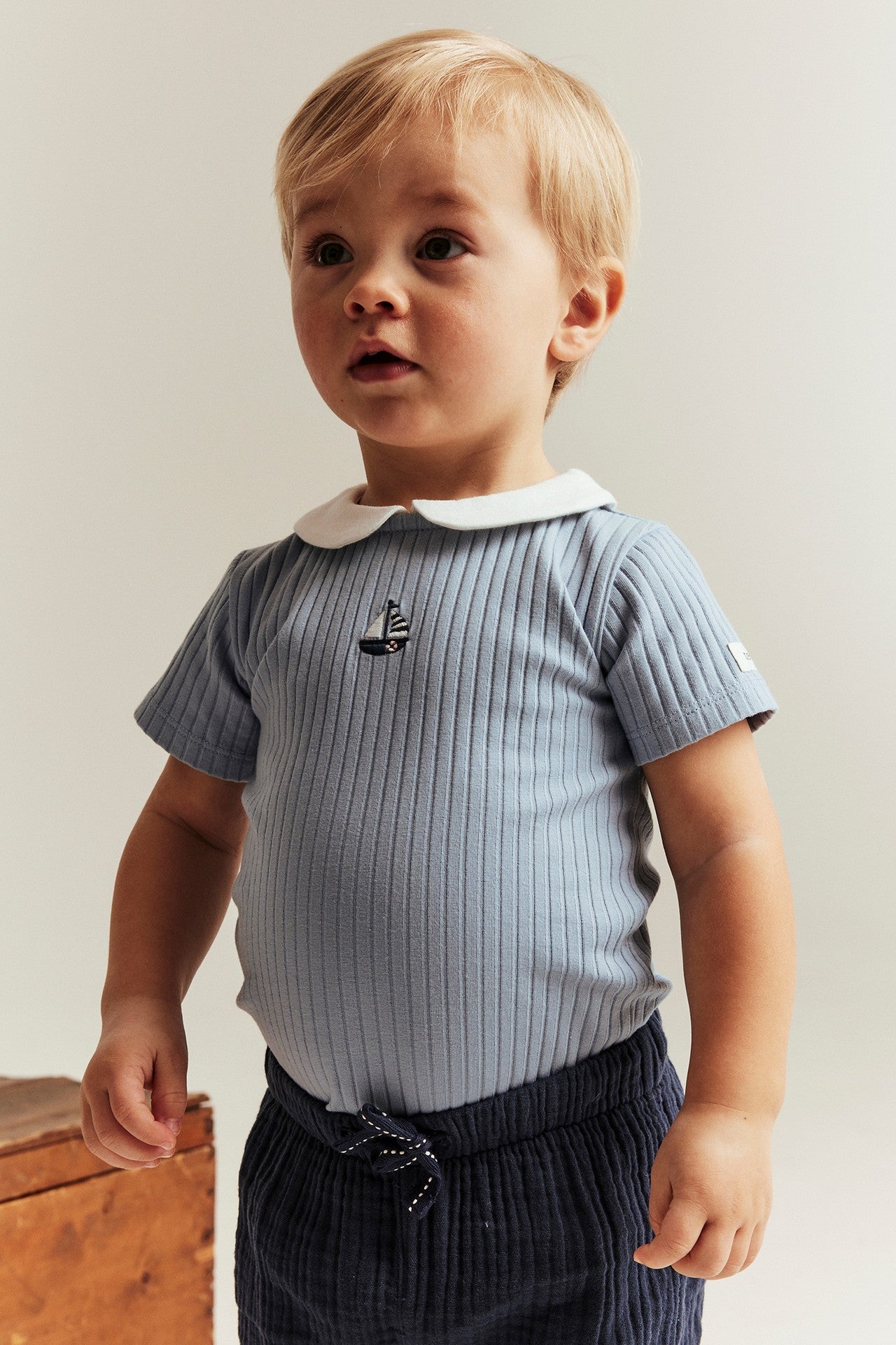 Baby blue bodysuit with sailboat