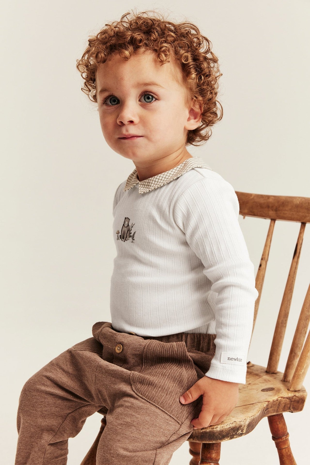 Baby bodysuit with checked collar