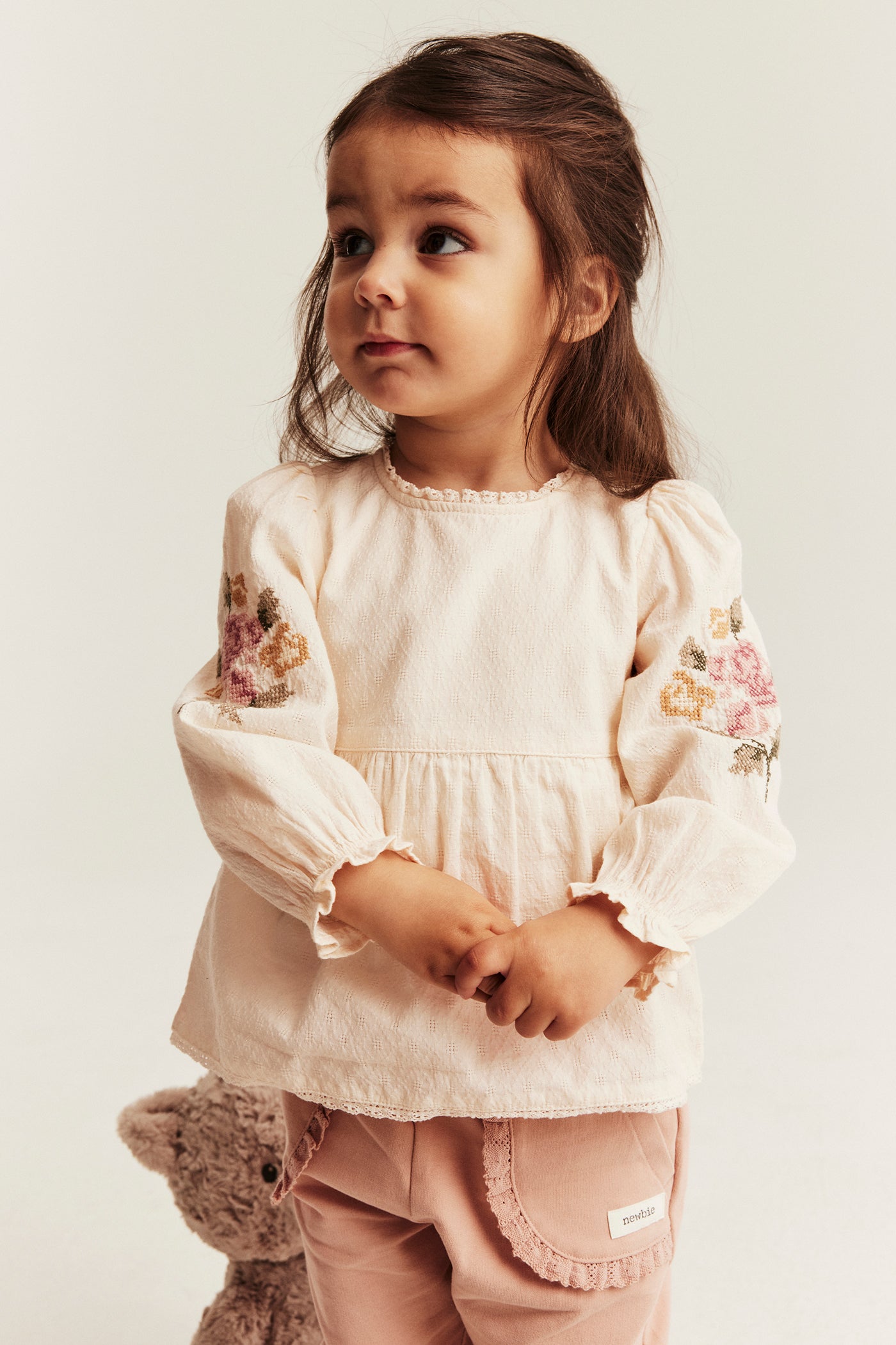Baby bodysuit with floral embroidery