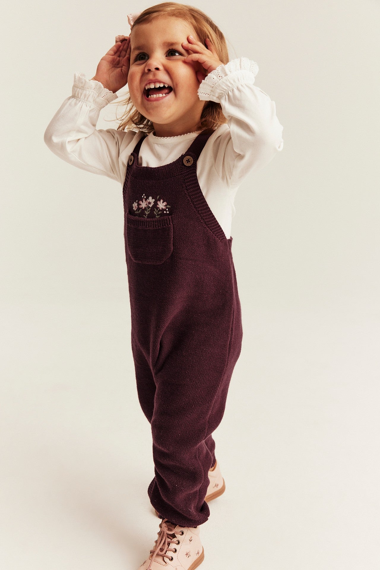 Baby knitted dungarees with embroidery