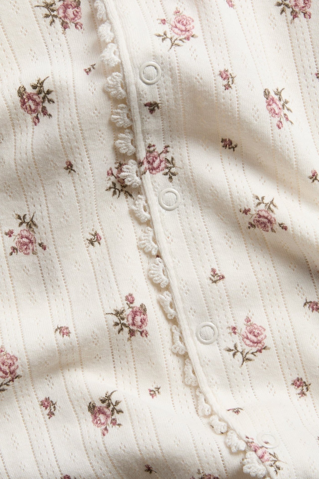 Baby pyjamas with rose pattern