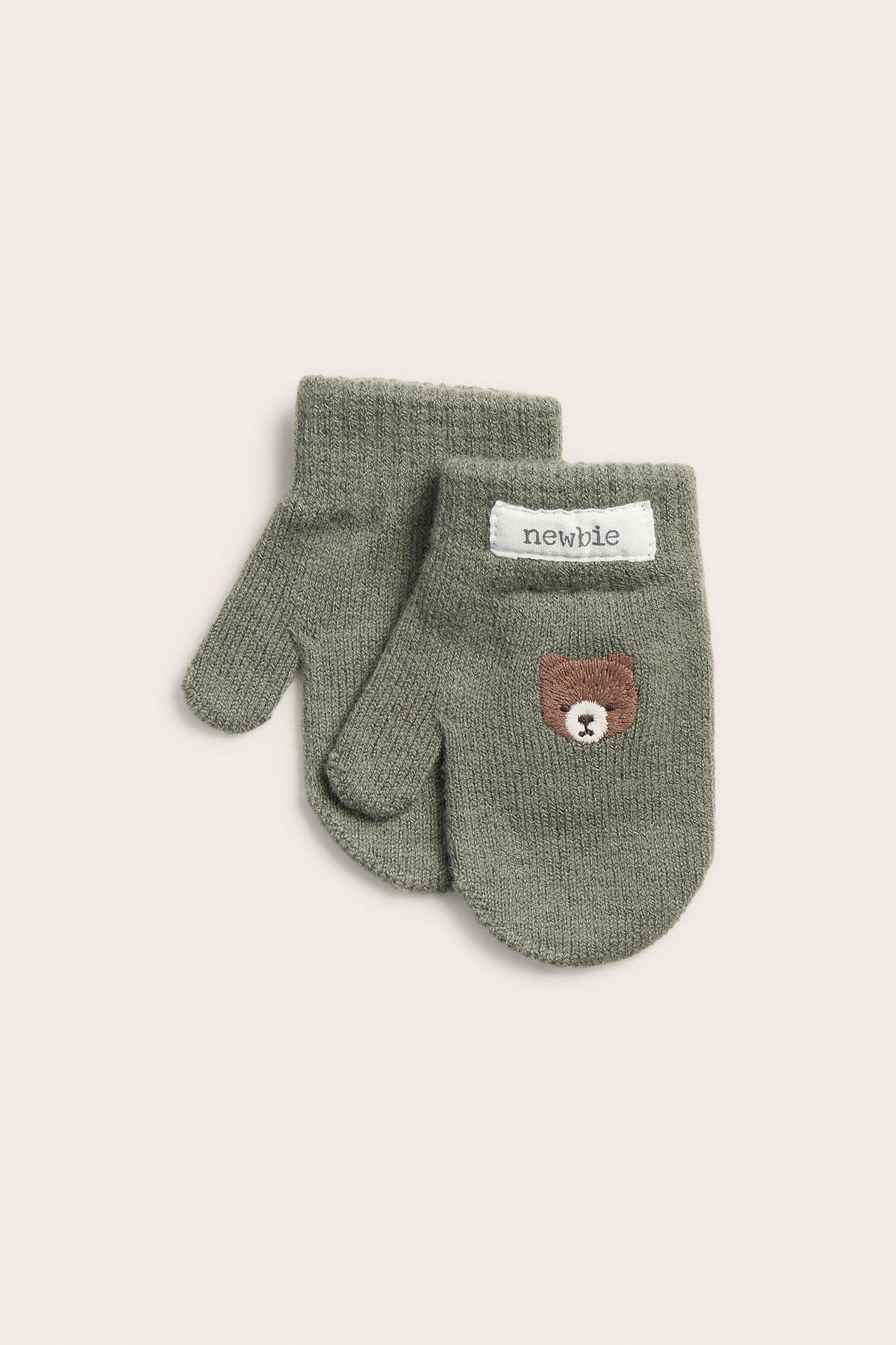 Baby knitted mittens with embroidered bear