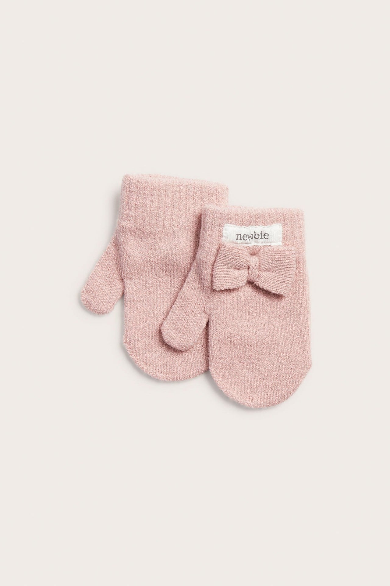 Baby pink knitted mittens with bow